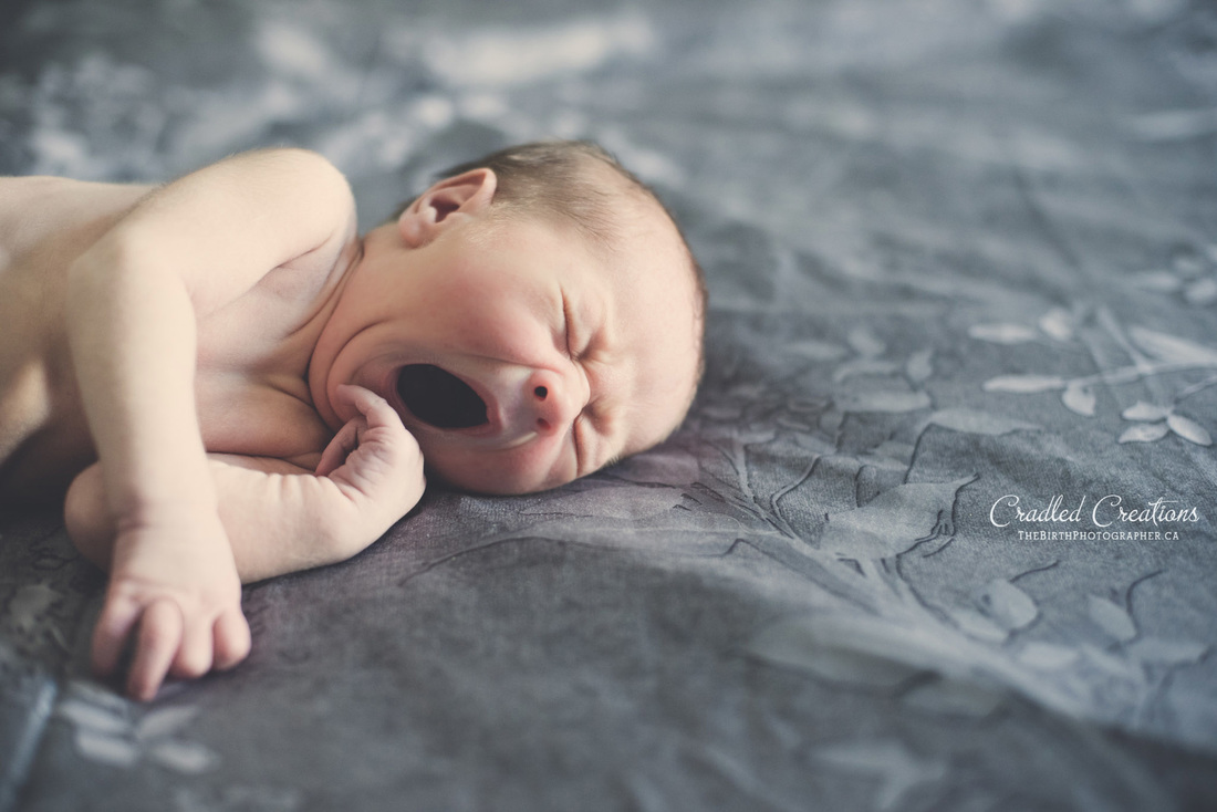 Yawing newborn baby
