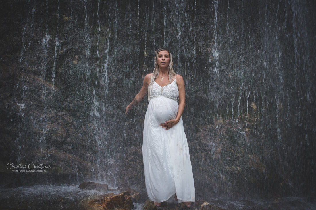 maternity photos in water, waterfall, rain