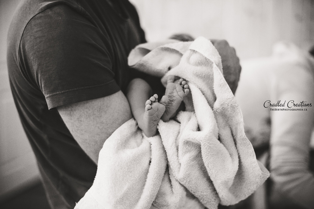 Birth Photography: In daddy's arms