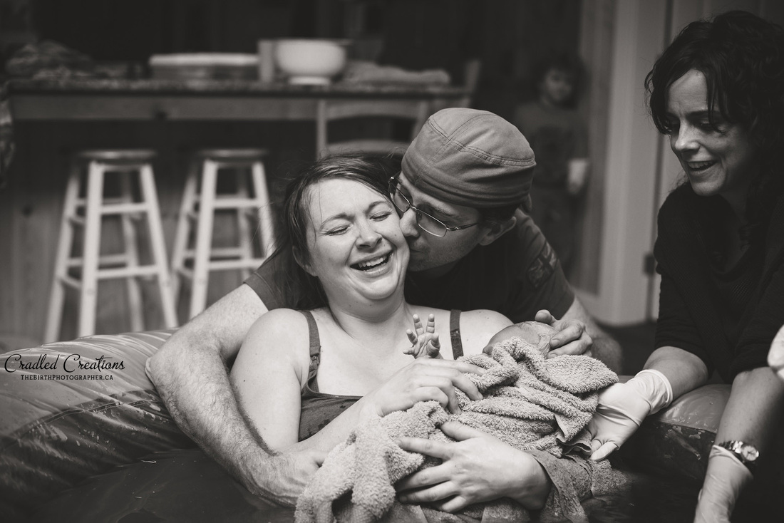 Birth Photography: beautiful love and affection (home birth)