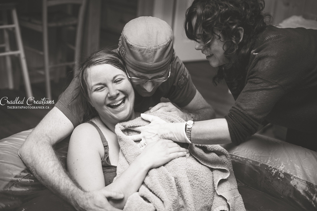birth photography: mom's reaction to birth
